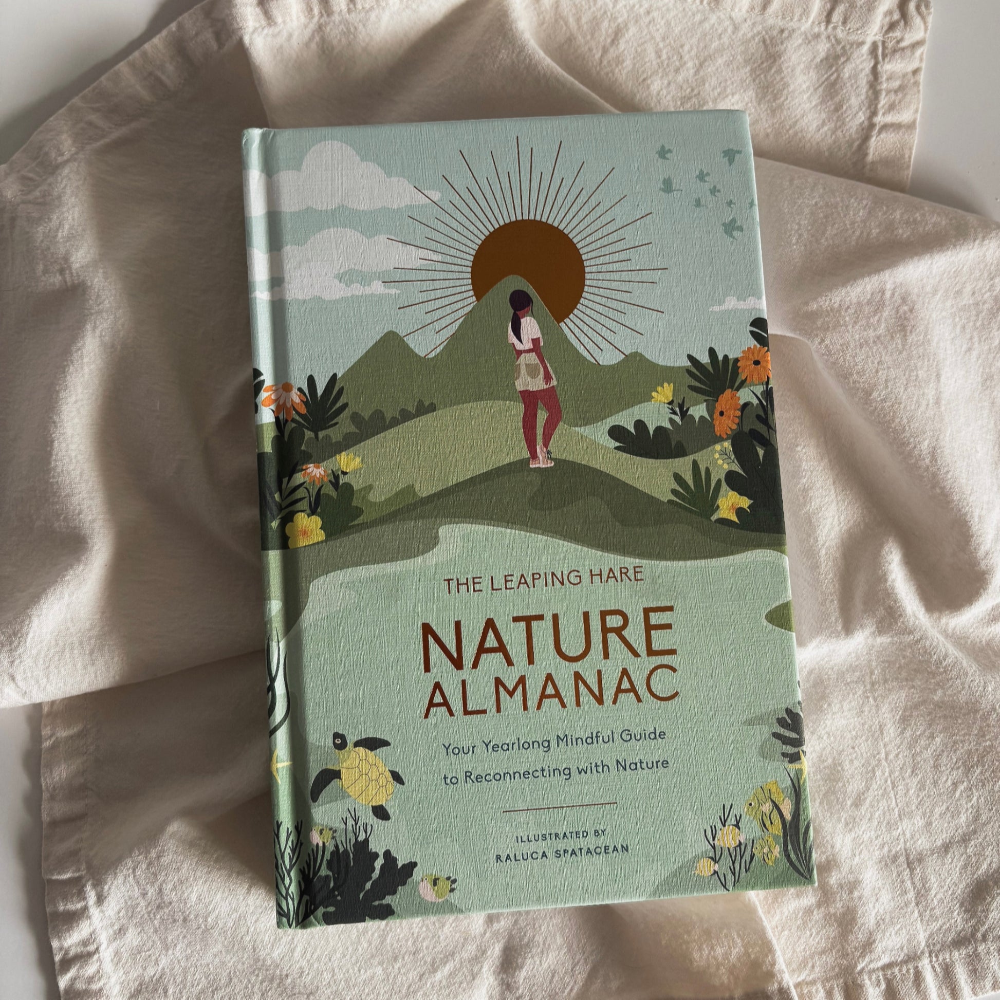 Nature Almanac: Your Yearlong Mindful Guide to Reconnecting With Nature book by Leaping Hare Press and Illustrated by Raluca Spatacean