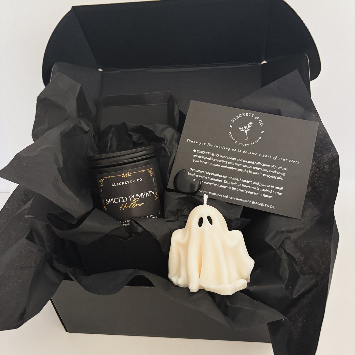 Spiced Pumpkin Hollow scented natural soy candle, unscented ghost-shaped soy candle, and Obsidian stone