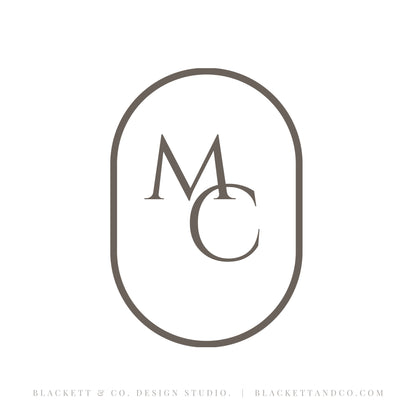 Antique Saw brand logo minimalist monogram logo featuring the letters 'M' and 'C' inside an oval border.