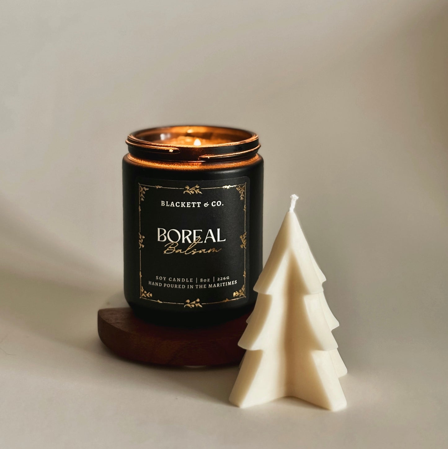Boreal Balsam scented natural soy candle hand poured by Blackett & Co. and a soy fir tree candle.