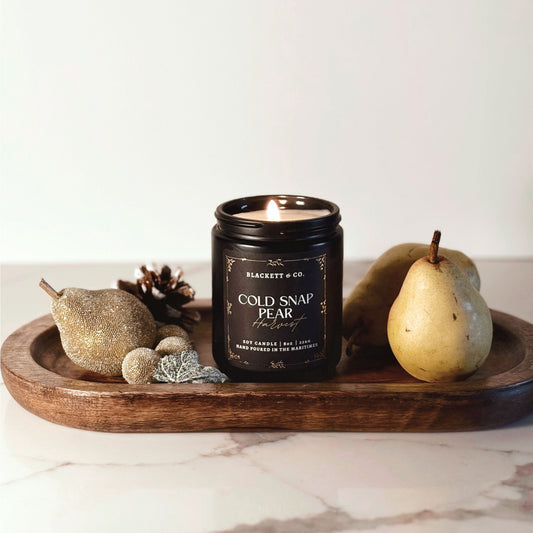 Cold Snap Pear Harvest scented natural soy candle hand poured by Blackett & Co. on a marble surface.