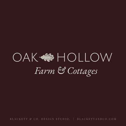 Oak & Hare theme logo with a dark burgundy background and centred white text with a small oak leaf icon between the words.
