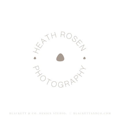 Photography brand logo minimalist circular logo with a small dot in the centre.
