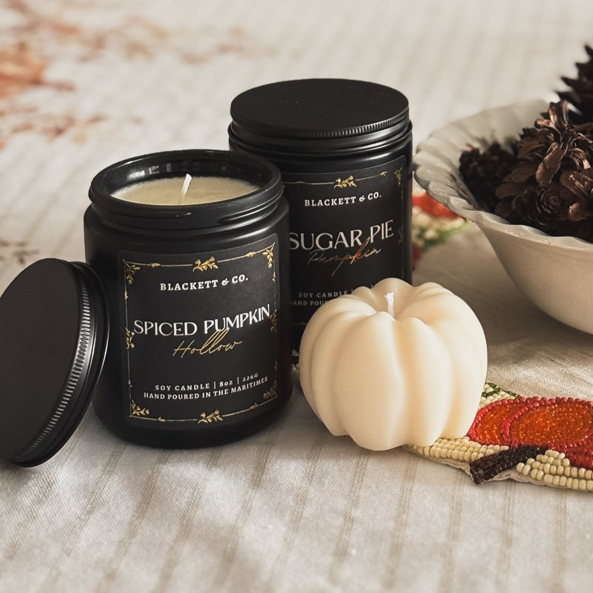 Spiced Pumpkin Hollow and Sugar Pie Pumpkin scented natural candle set with an unscented candle in the shape of a pumpkin.