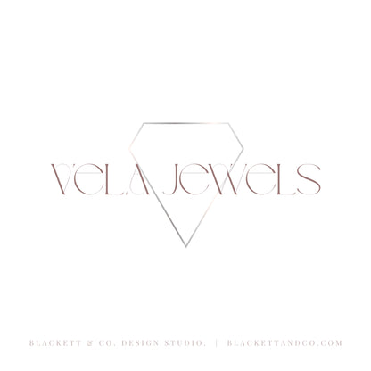 A minimalist logo for Vela Jewels, featuring a thin geometric diamond outline in rose gold over the brand name in a matching serif typeface, set against a solid white background.